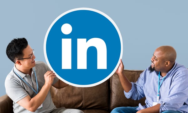 people-holding-linkedin-logo